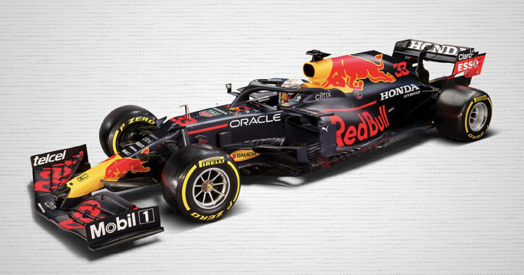 Red Bull Racing Formula 1 car with bold livery on dotted white background showcasing design Wallpaper