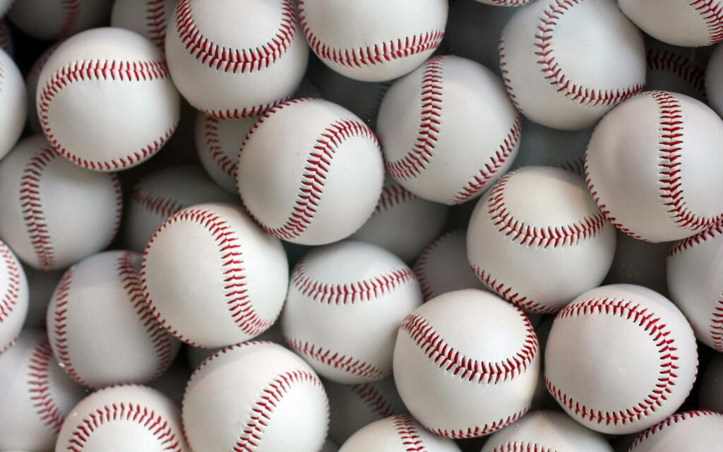 Red and Blue Baseballers Ready to Play on Field Wallpaper