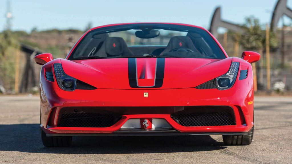 Exquisite showcase of the Ferrari 458 Speciale's allure and dominance on the open road Wallpaper