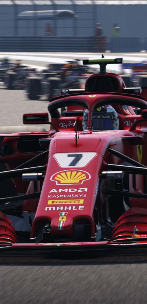 Close-up of red Ferrari F1 2018 racing car speeding on track in thrilling motorsport wallpaper