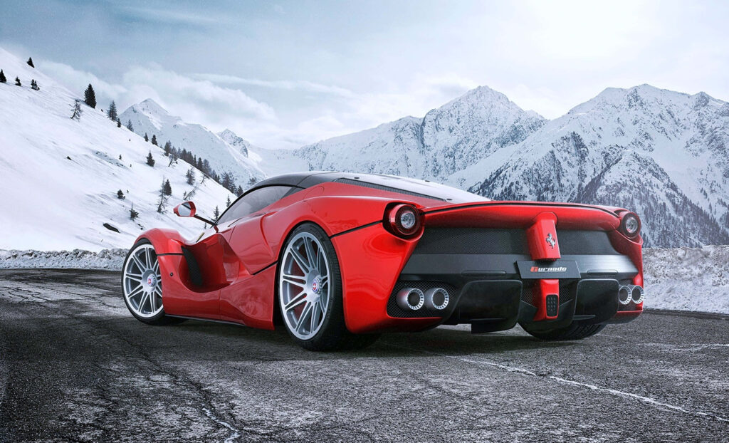 Unleashing the Power: The Dazzling Red Ferrari LaFerrari Roaring Across the Open Road Wallpaper