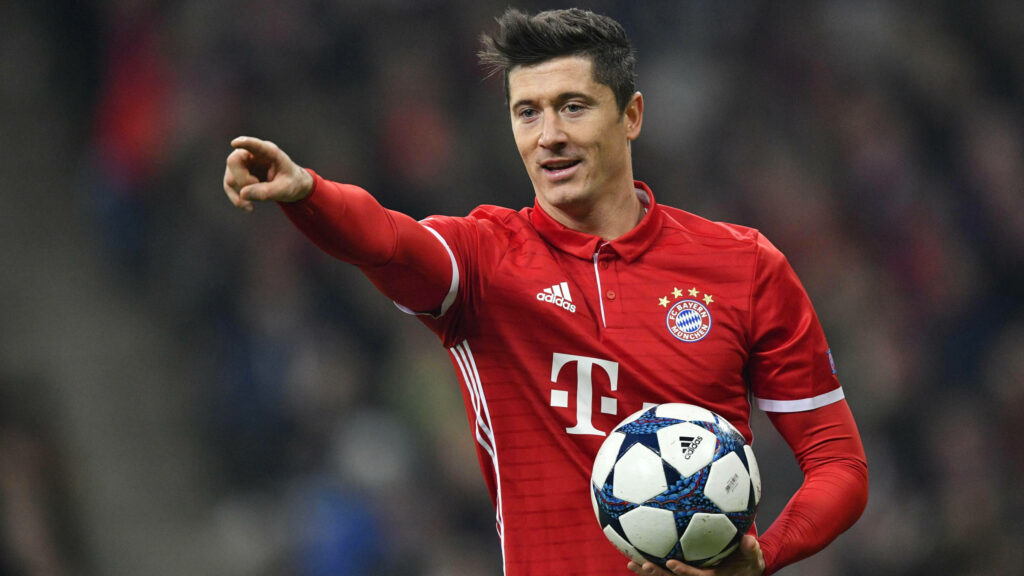 4k Action Shot: Robert Lewandowski in Red Uniform, Emphasizing Off-Screen Moment Wallpaper