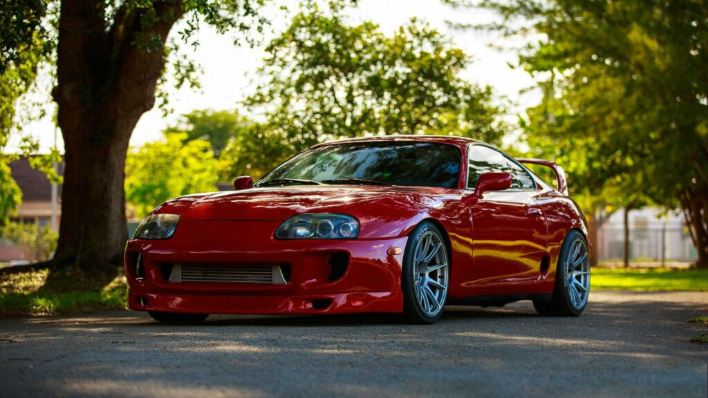 The Ruby Jewel: A Stunning Red Toyota Supra Wallpaper