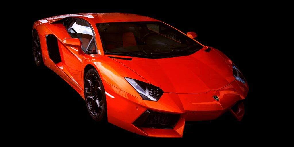Red Lamborghini Aventador Wallpaper: Sleek Design on Black Background