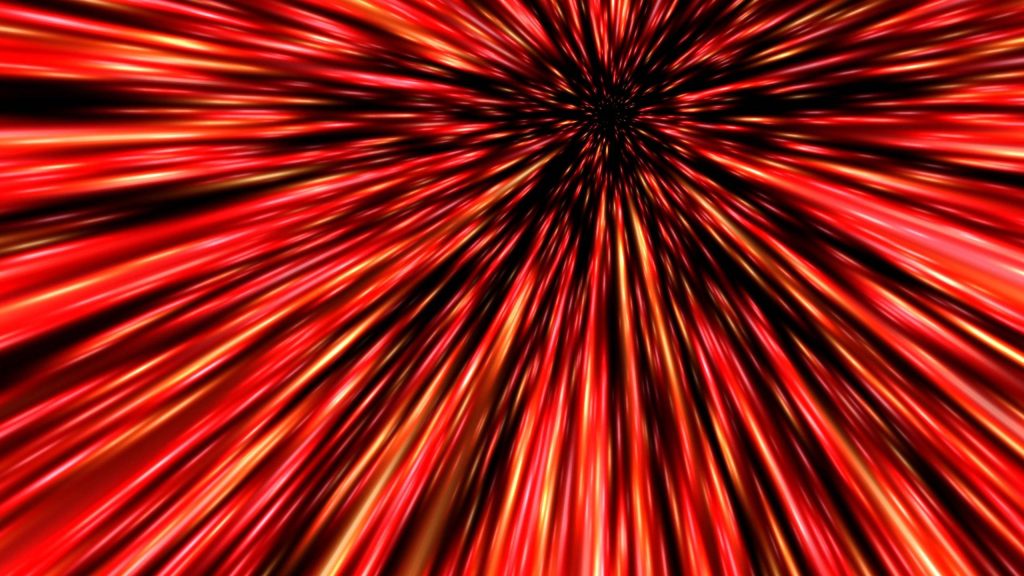 Abstract red light speed wallpaper with vibrant radial streaks and glowing sci-fi warp effect