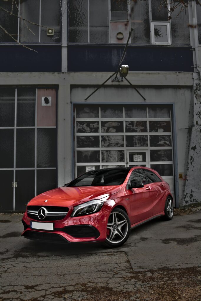 Stunning Red Mercedes-Benz CLS-Class Against Urban Background Wallpaper