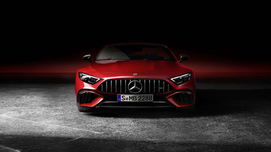 Red Mercedes-Benz sports car sleek design powerful presence dramatic dark wallpaper background