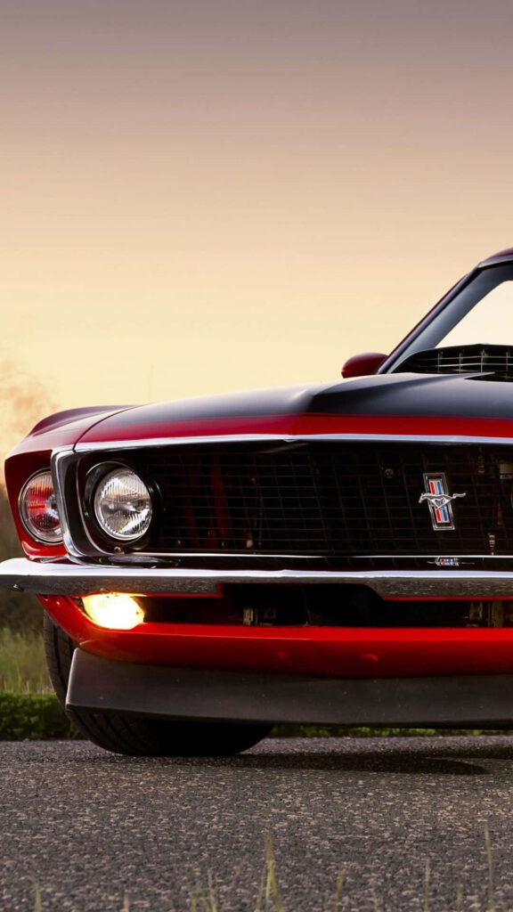 Red Mustang iPhone wallpaper muscle car with sunset background stylish automotive design