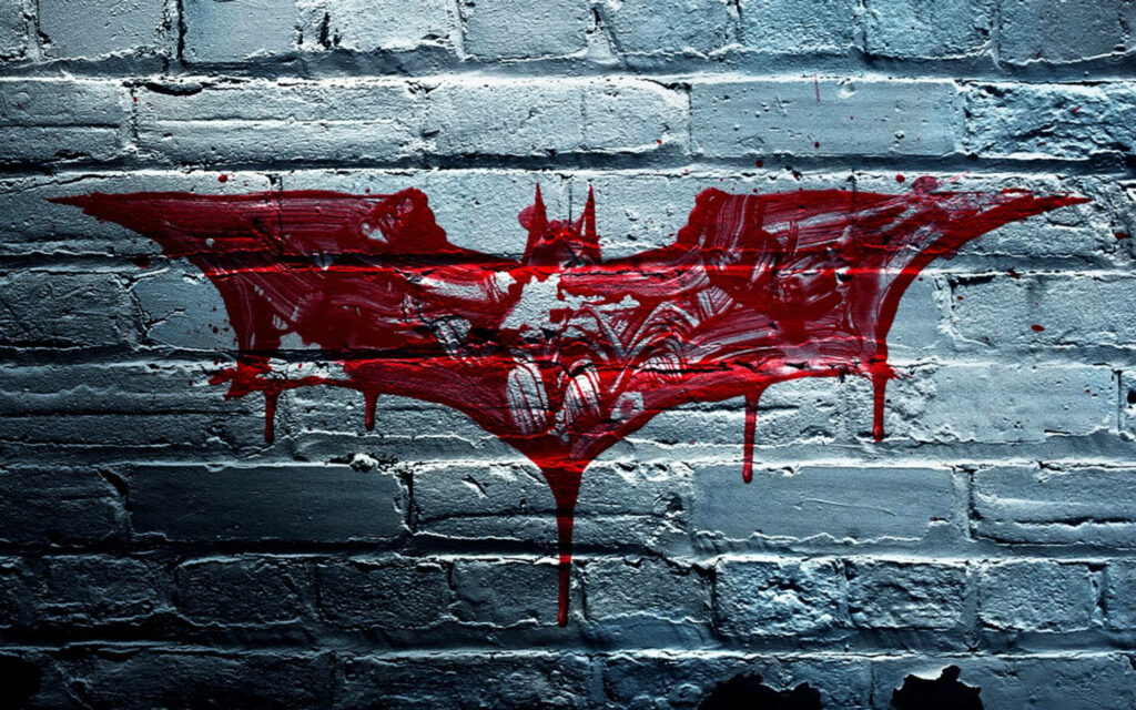 Batman logo wallpaper red paint dripping on weathered gray brick wall gritty cinematic art
