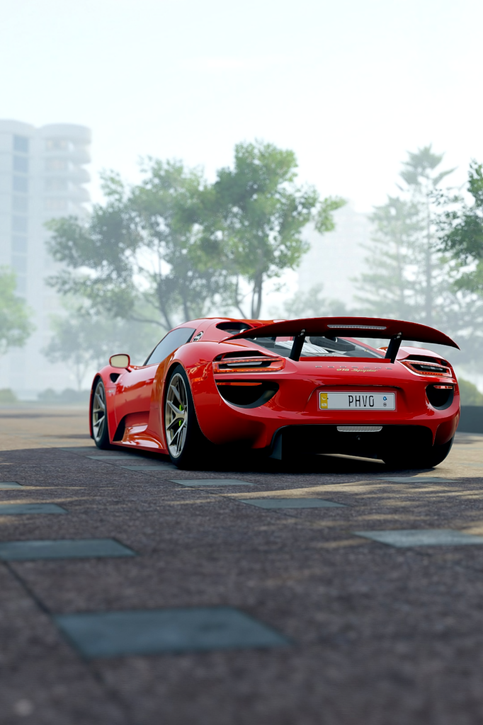 Red Porsche 918 Wallpaper: Sleek Sports Car in Urban Greenery