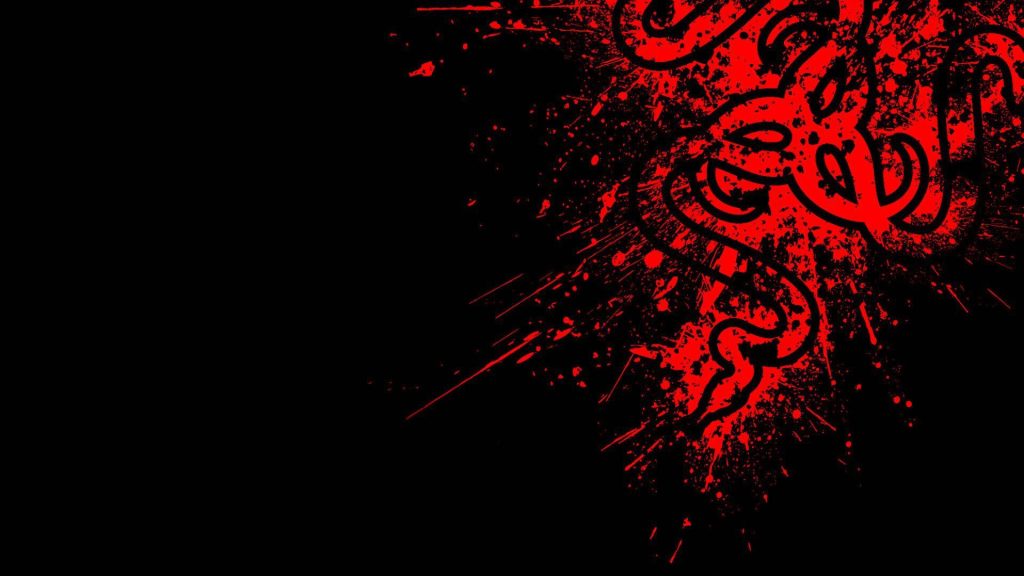 Razer gaming wallpaper with red paint-splatter three-headed snake logo on black background