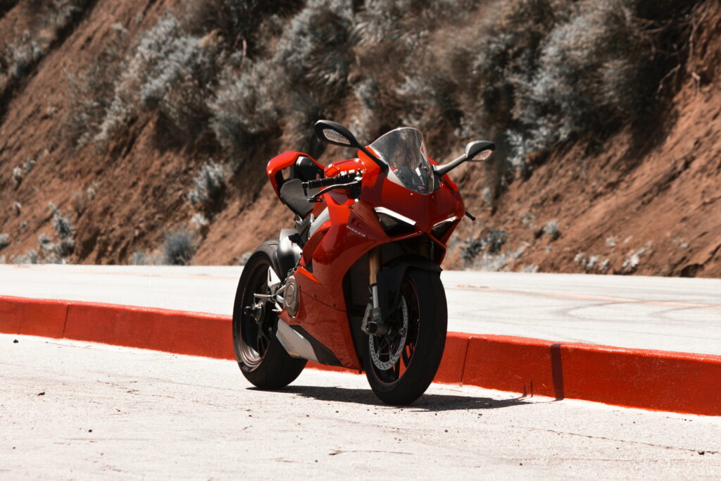 Vibrant Red Sport Bike: Scenic 5K Wallpaper featuring a Thrilling Two-Wheeled Ride