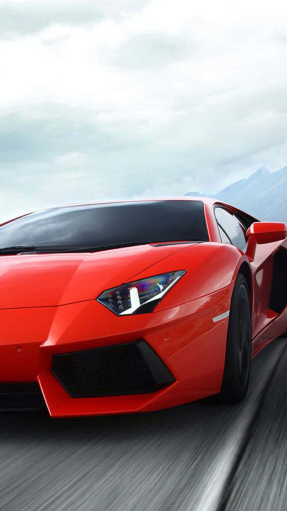 Red sports car speeding on sleek road with dynamic sky and modern landscape background Wallpaper