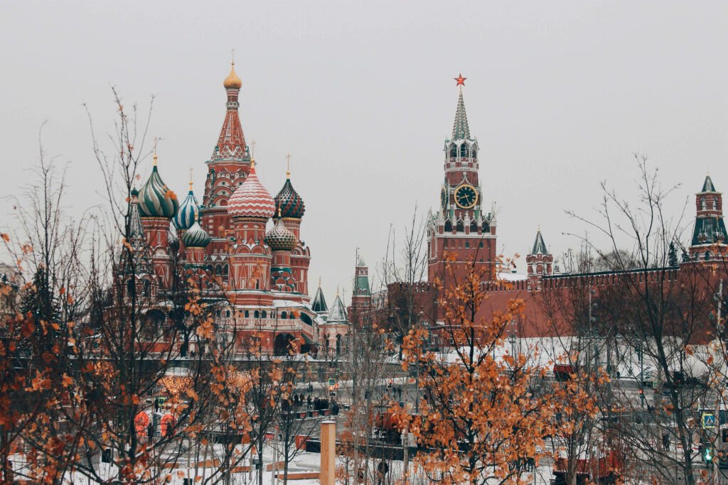 Red Square Moscow autumn wallpaper with Saint Basil's Cathedral domes and snowy golden foliage