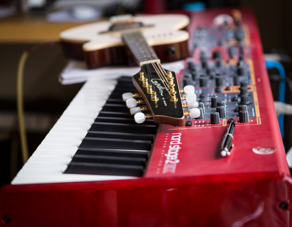 Red Synthesizer & Guitar Wallpaper: A Harmony of Musical Creativity