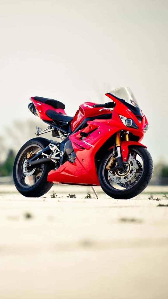 Dynamic Red Triumph Daytona Wallpaper - Sporty Motorcycle Aesthetic