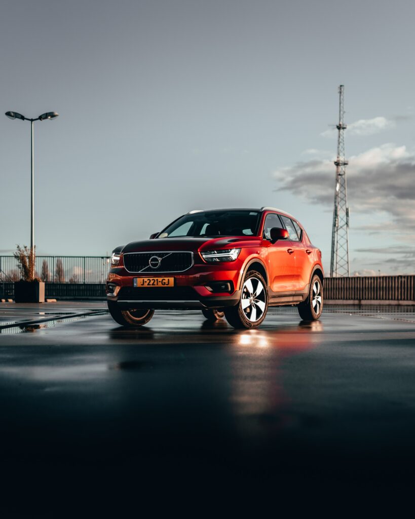 Stunning Red Volvo XC40 SUV in Urban Setting - Wallpaper Design