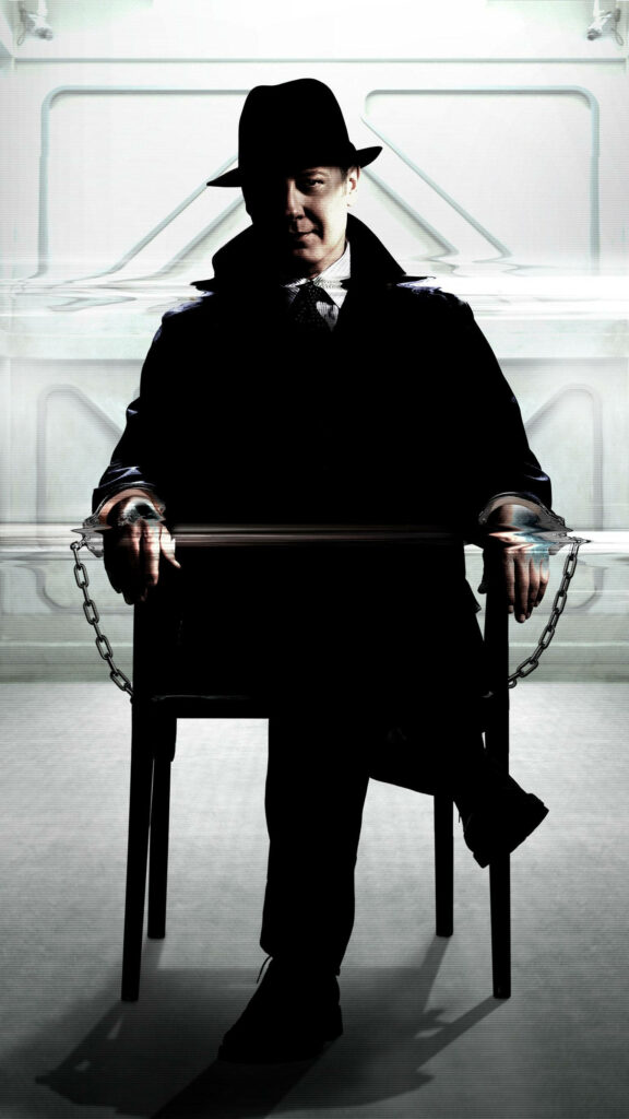 Reddington from The Blacklist seated in chair intense mysterious wallpaper background for fans