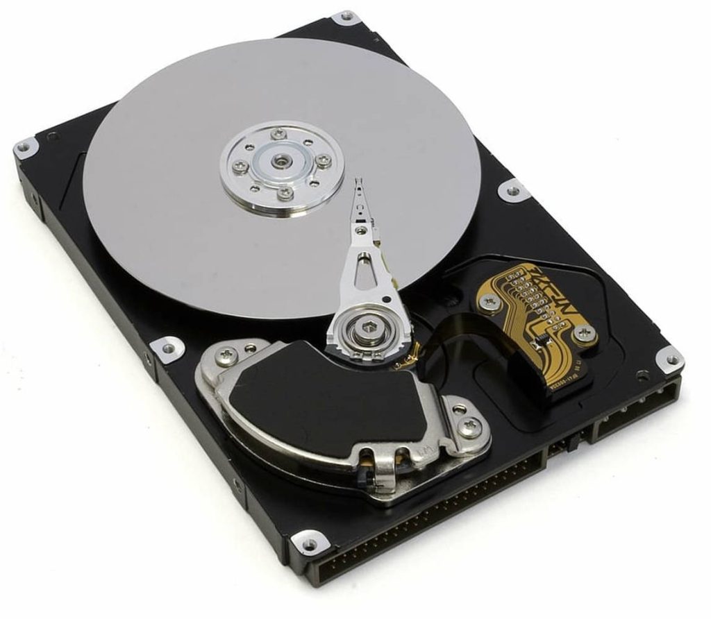 Open computer hard drive with visible silver platter and actuator arm detailed close-up wallpaper