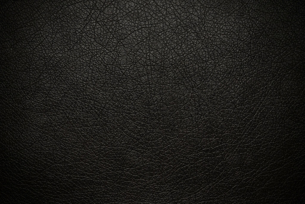 Sleek Patterns: Abstracted Black Leather Wallcovering Unveiling Textured Elegance Wallpaper