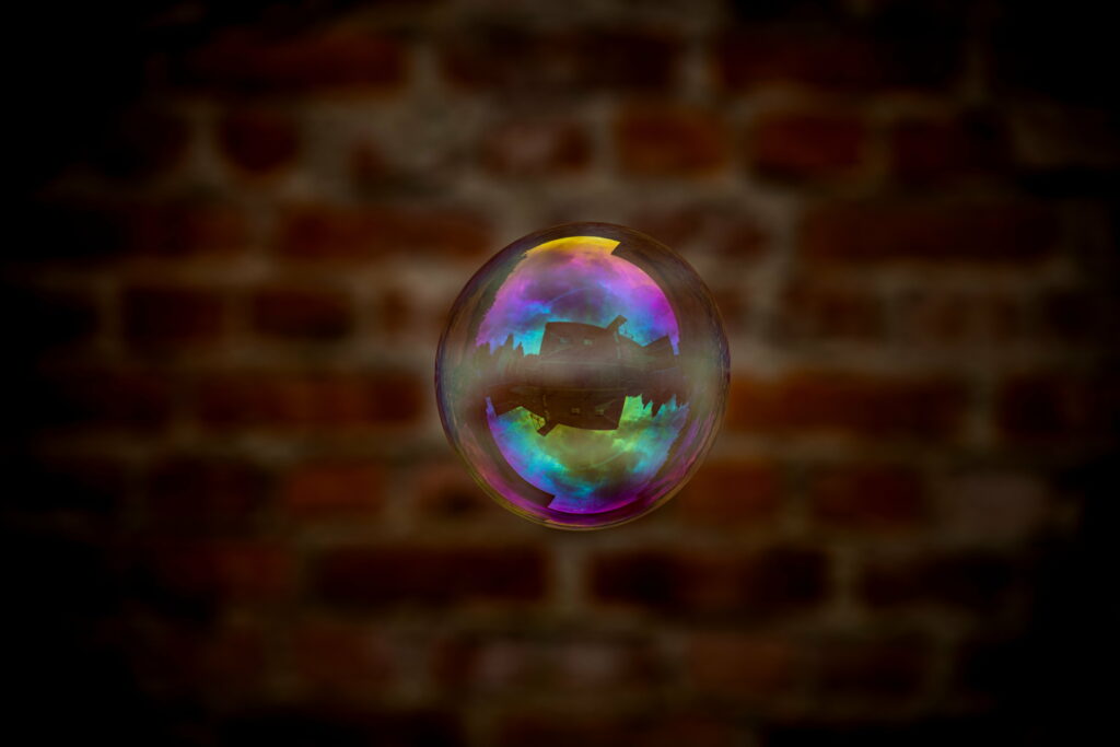 Reflective Tranquility: A Captivating Soap Bubble in a 5K Wallpaper Background