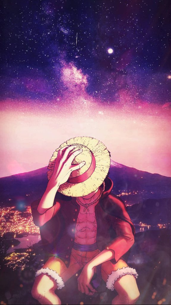 Monkey D Luffy One Piece wallpaper under purple starry sky with glowing city lights background