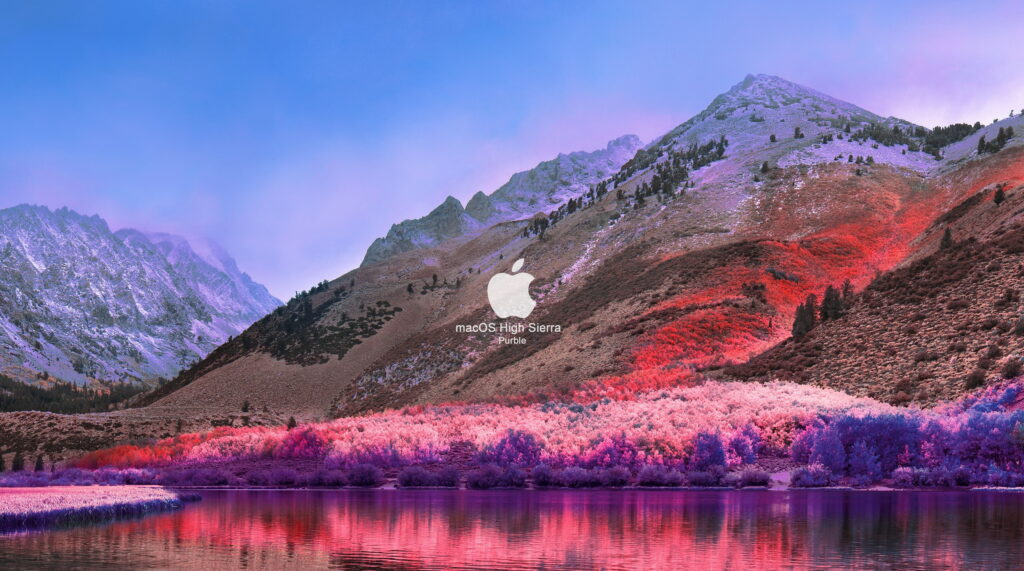 Majestic Sierra Nevada mountains with purple hues reflected in calm water macOS High Sierra wallpaper