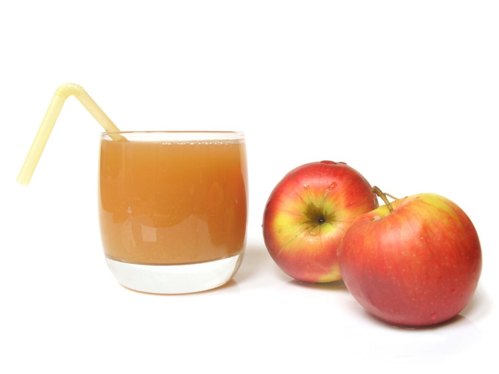 Fresh Apple Juice with Red Apples on White Background Wallpaper