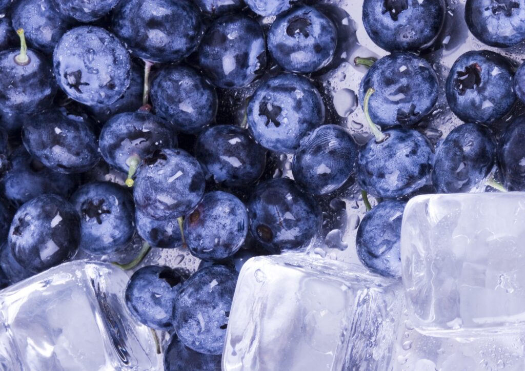 Vibrant Blueberries with Ice Cubes: Freshness Wallpaper Background