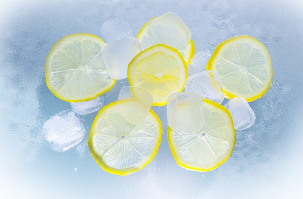 Vibrant Lemon Slices & Ice Cubes Wallpaper Background