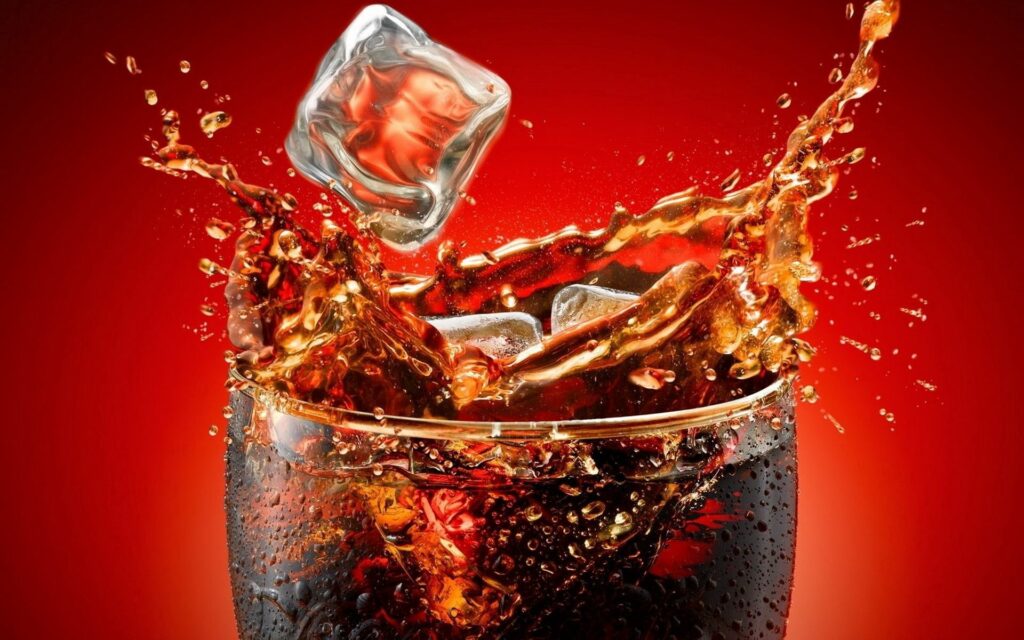 Vibrant Coca-Cola Splash with Ice Cubes – Wallpaper Background