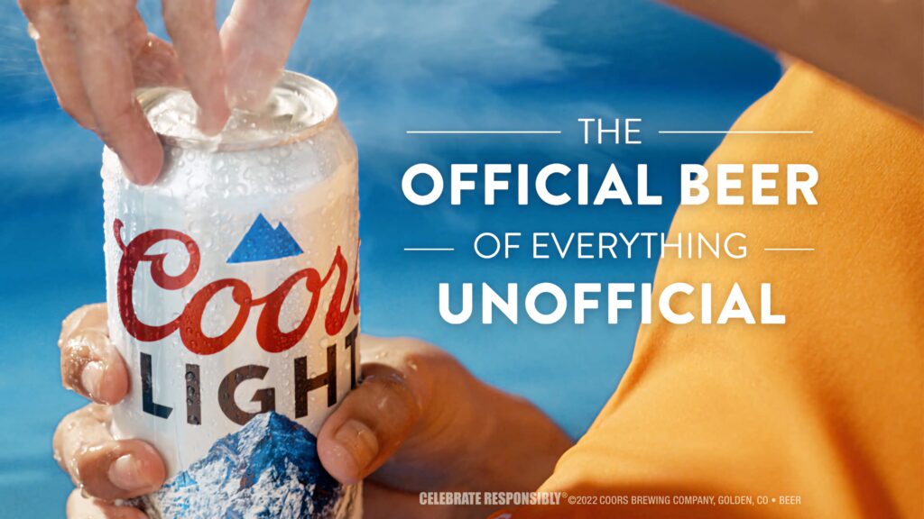 Coors Light can opening with cold spray and mountain logo on vibrant blue background summer vibe Wallpaper