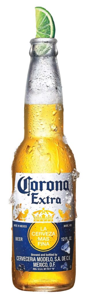 Chilled Corona Extra beer bottle with lime wedge and cold droplets on summer wallpaper background