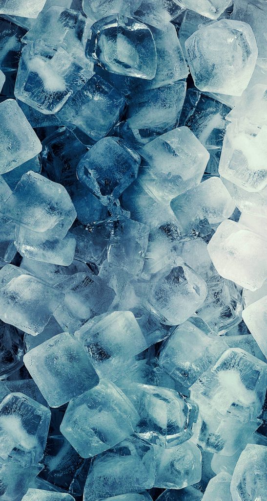 Close-up of clear ice cubes with frosty textures in blue and white for refreshing wallpaper