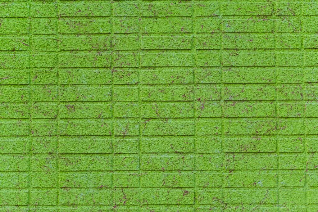 Brick Integration into a Refreshing Light Green Plain - Captivating Background Image Wallpaper