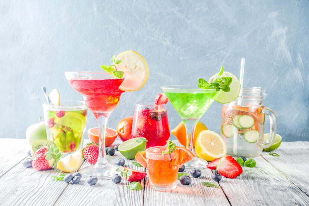 Refreshing Delights: A Vibrant Still Life of Tantalizing Food and Cocktails Wallpaper