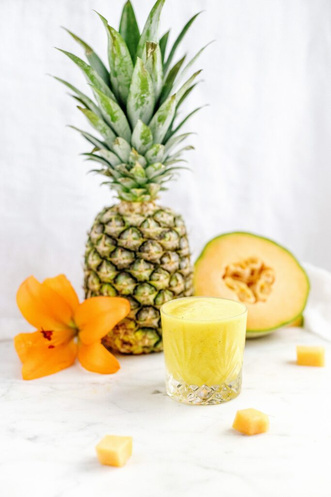 Vibrant Fruit Smoothie & Fresh Melon Wallpaper on Marble Surface