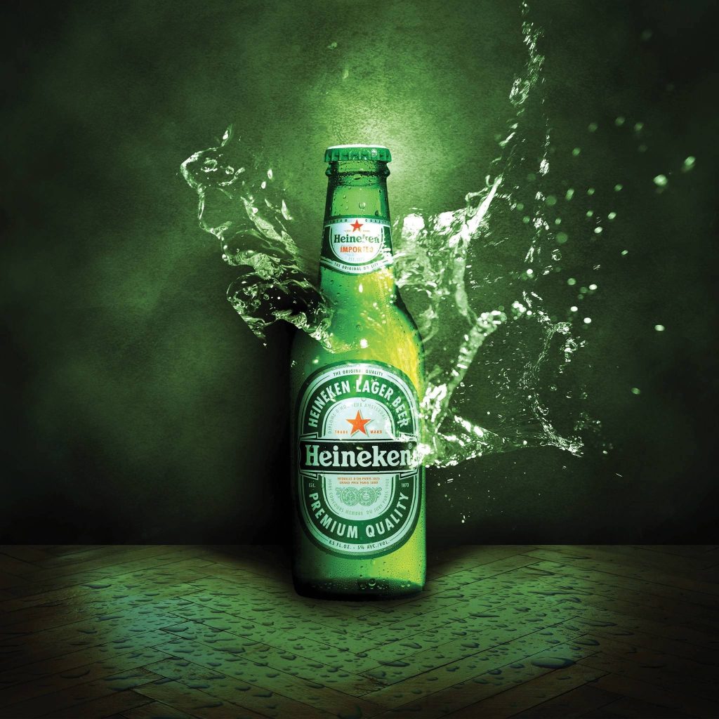 Heineken beer bottle with water splashes on wet wood dark green background refreshing wallpaper
