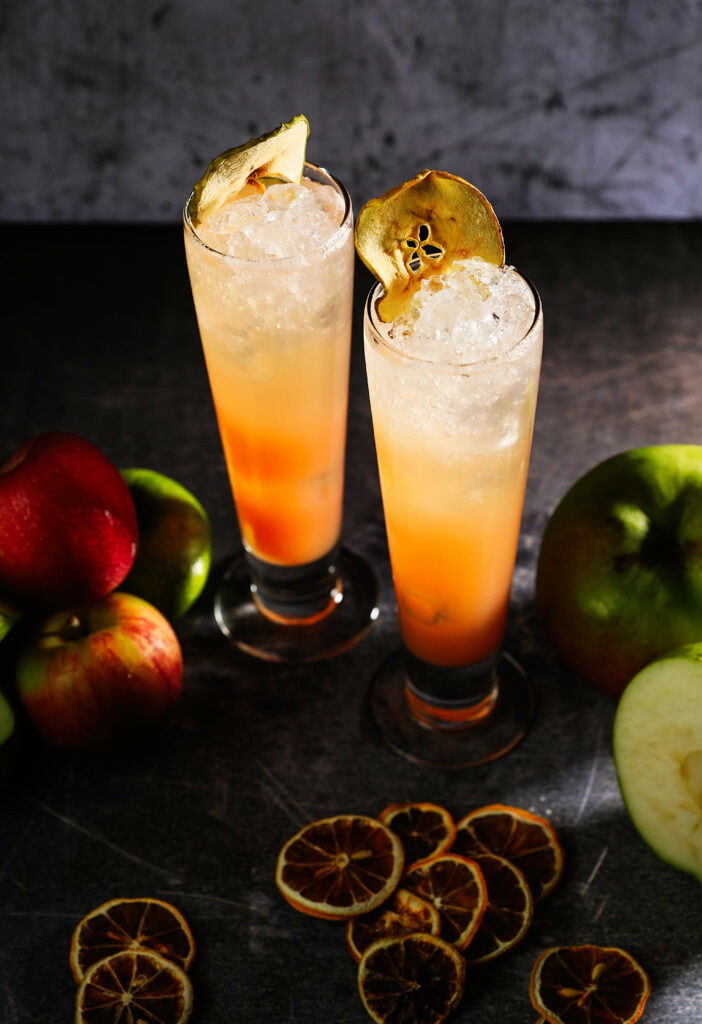 Refreshing Drink Wallpaper: Ice-Cold Glasses with Apple Garnish