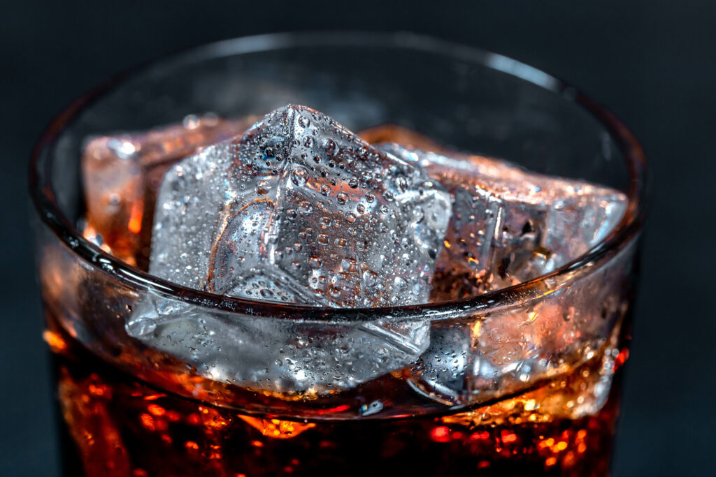 Refreshing Close-Up Wallpaper: Ice Cubes & Bubbles in Dark Liquid