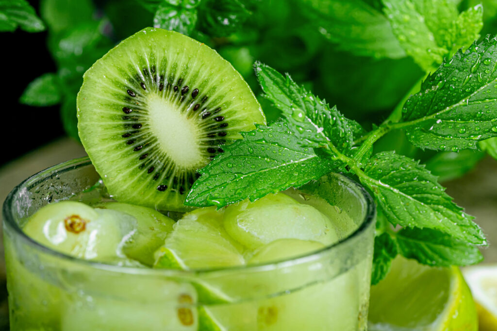 Refreshing Kiwi Mint Wallpaper: Close-Up with Ice & Water Droplets