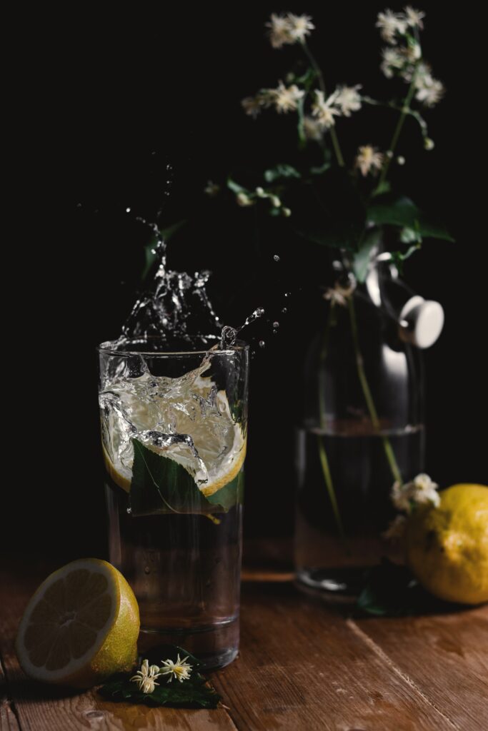 Lemon-Infused Water Wallpaper with Fresh Lemons & Flowers