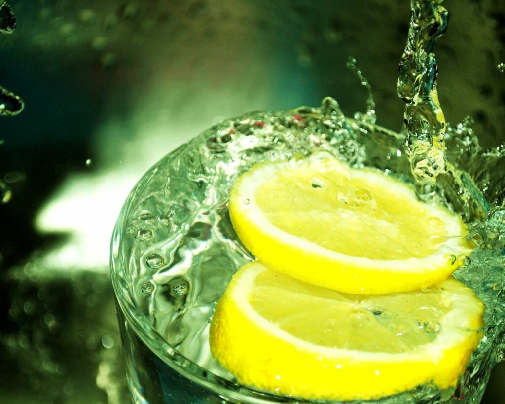 Energizing Lemon Splash Wallpaper: Refreshing Background Design