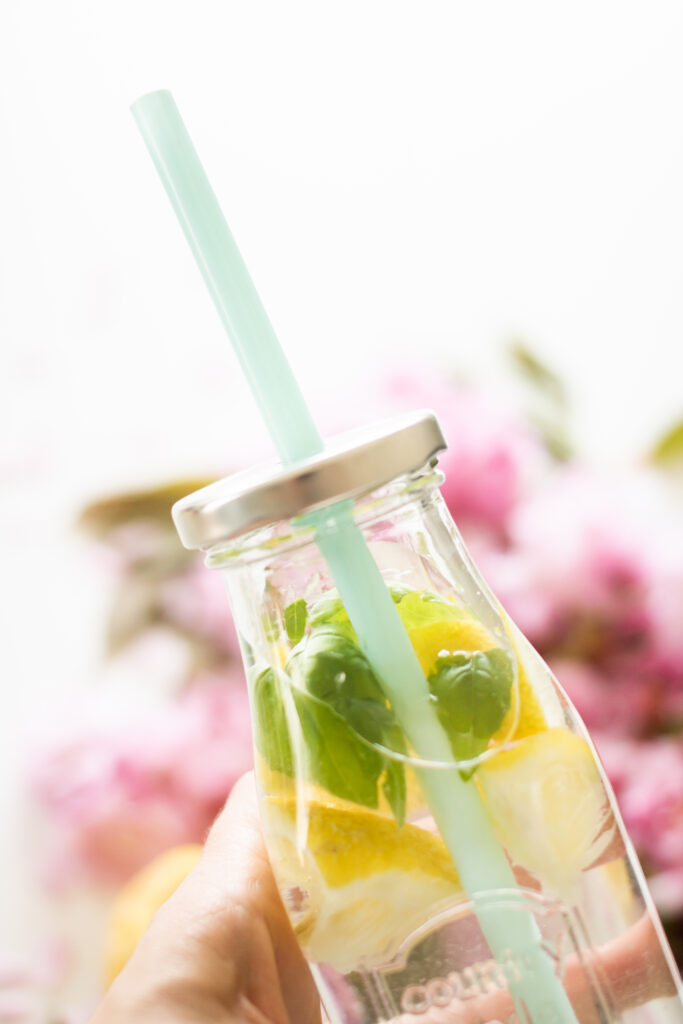 Refreshing Lemonade in Clear Bottle - Bright Wallpaper Background