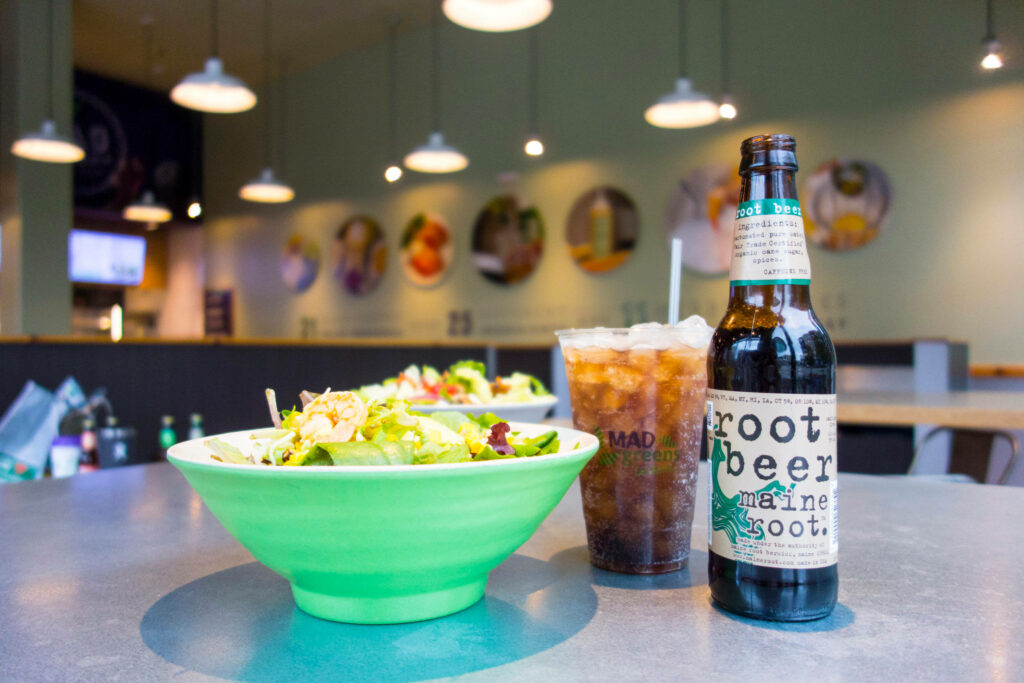 Refreshing Maine Root Beer & Colorful Salad in Cozy Restaurant Ambiance Wallpaper