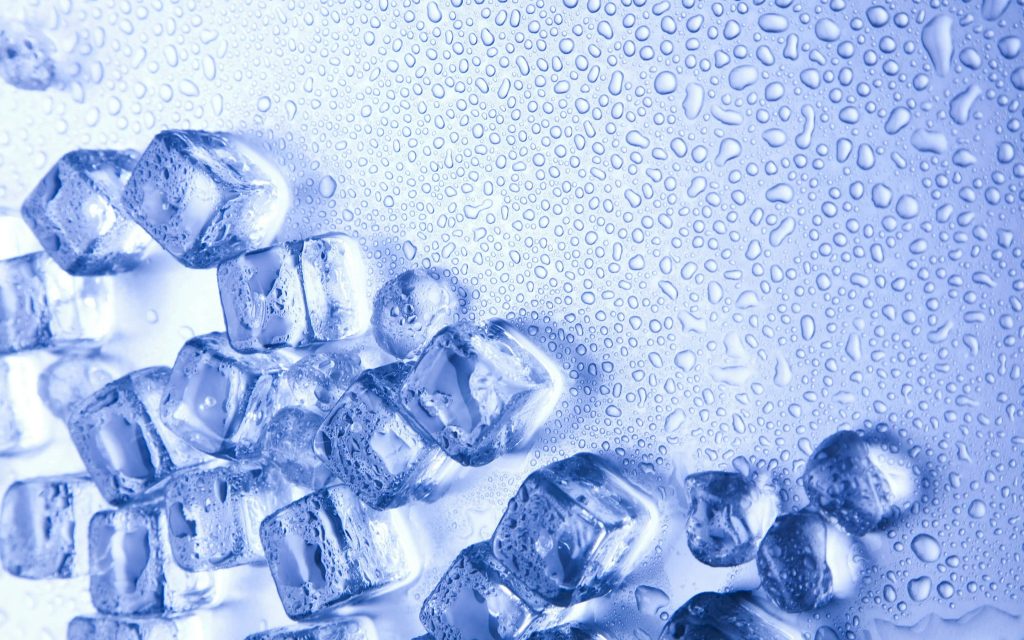 Refreshing macro wallpaper of melting ice cubes with blue water droplets on clean surface