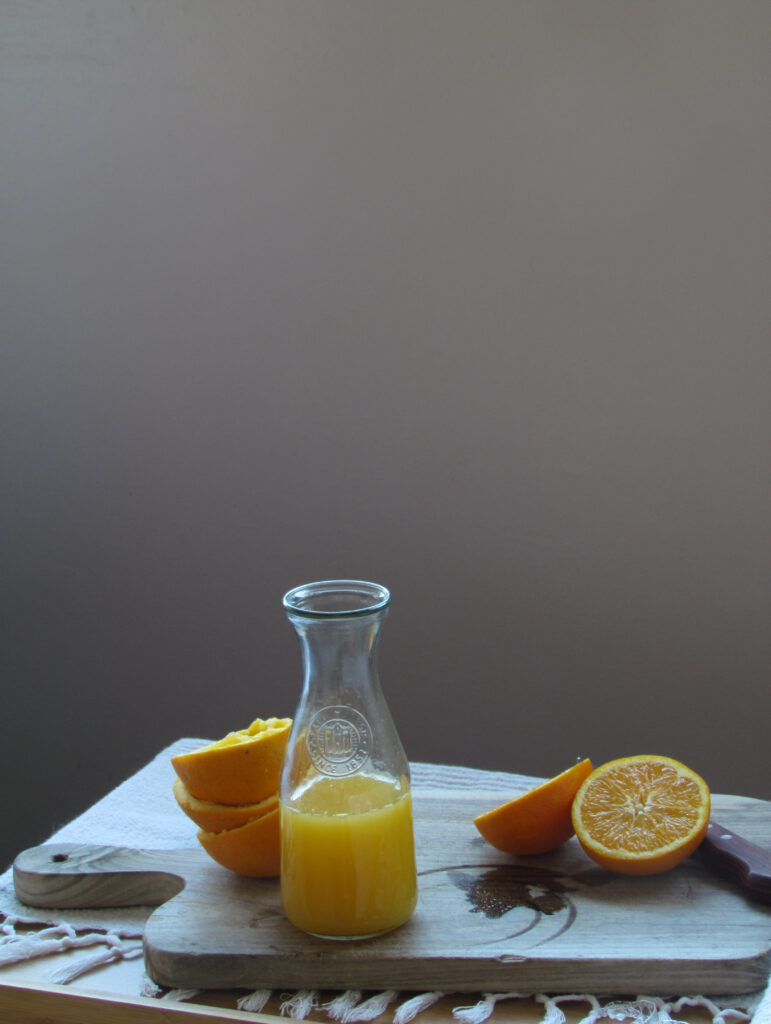 Fresh Orange Juice & Slices on Wooden Board - Minimalist Wallpaper