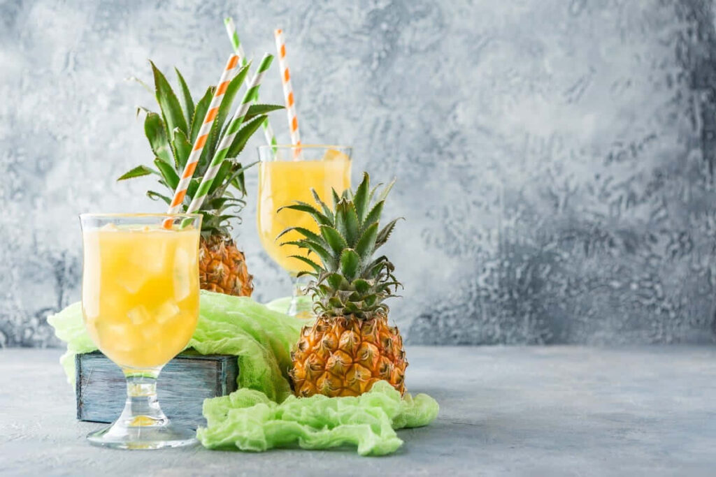 Refreshing Pineapple Juice Wallpaper with Fresh Pineapples & Green Cloth