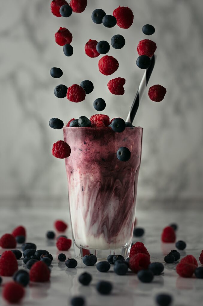 Refreshing Raspberry Blueberry Smoothie Wallpaper with Whole Berries