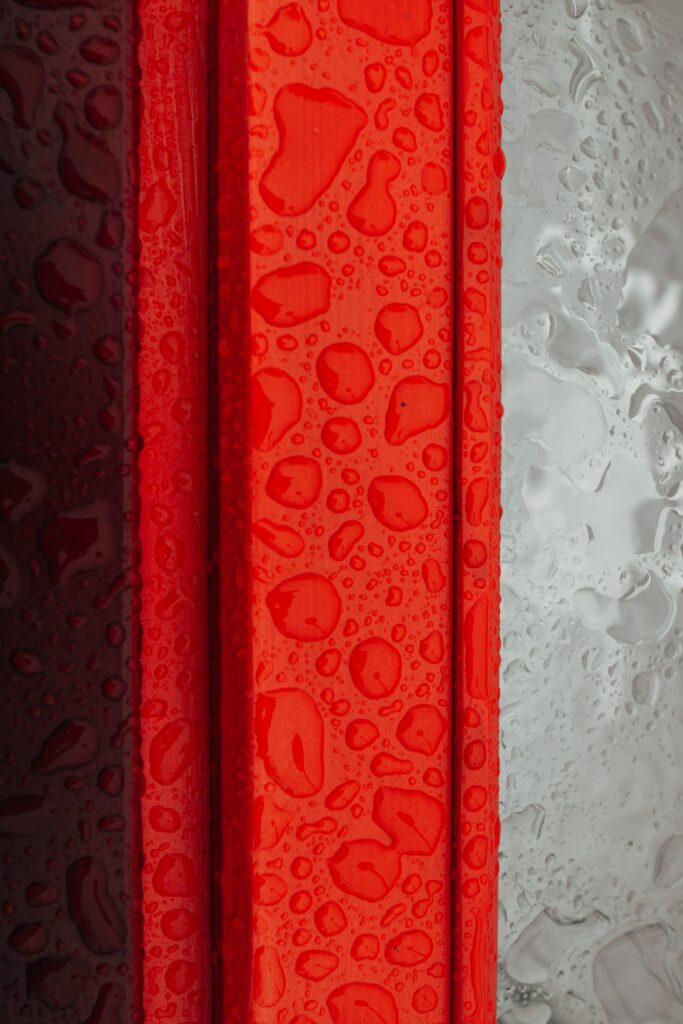 Vibrant Red and Gray Moisture-Drop Wallpaper Background